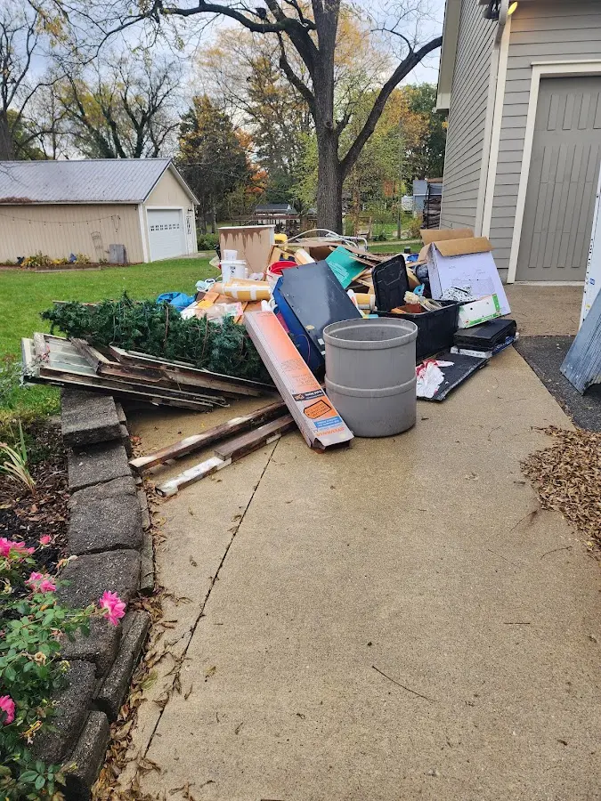 Dumpster being loaded with debris for 3 Yard Dumpster Rental in Quail Ridge